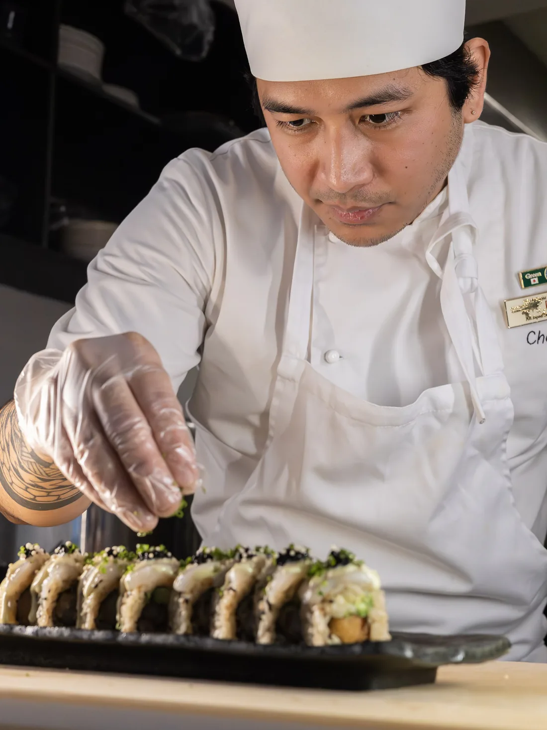 Chef at Sushi Roll preparing a roll